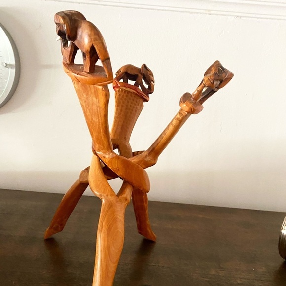 3 handcarved elephants intertwined wooden plant holder